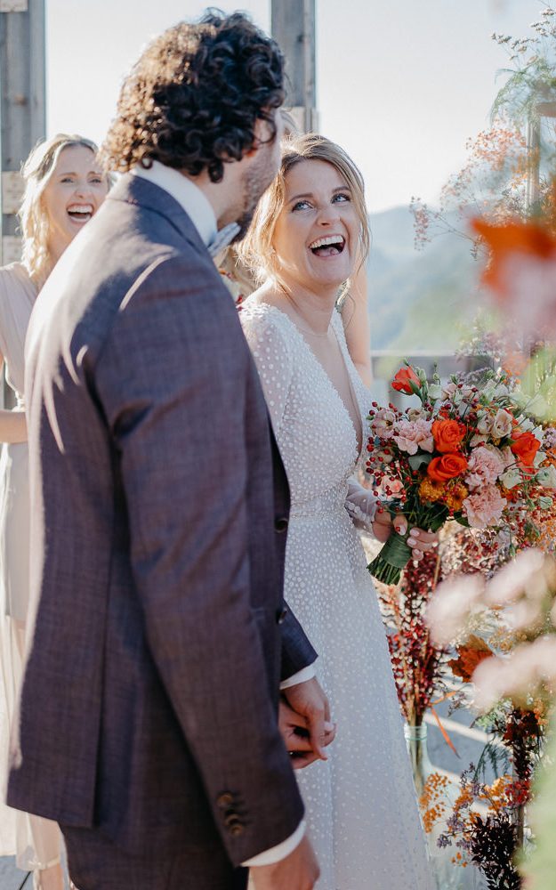 Red Fireworks Above Wedding Couple